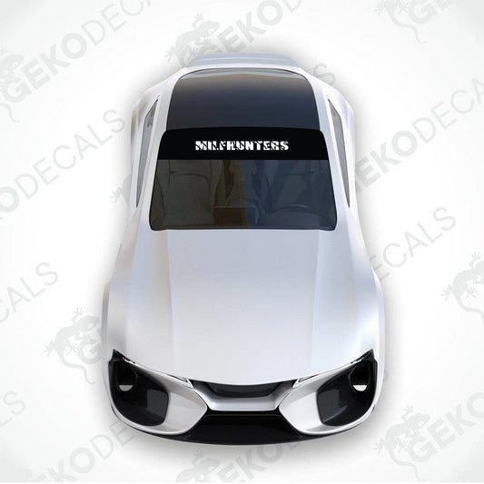 Black car windshield sun visor with white text MILFHUNTERS