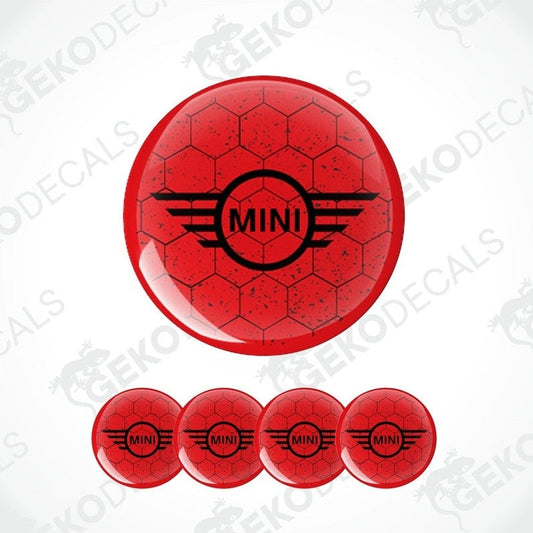A set of four red vinyl stickers with the text 'MINI COOPER' and a graphic design resembling a stylized airplane or a winged logo.