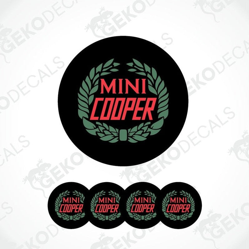 A set of four black, red, and green vinyl stickers with the text 'MINI COOPER' in the center.
