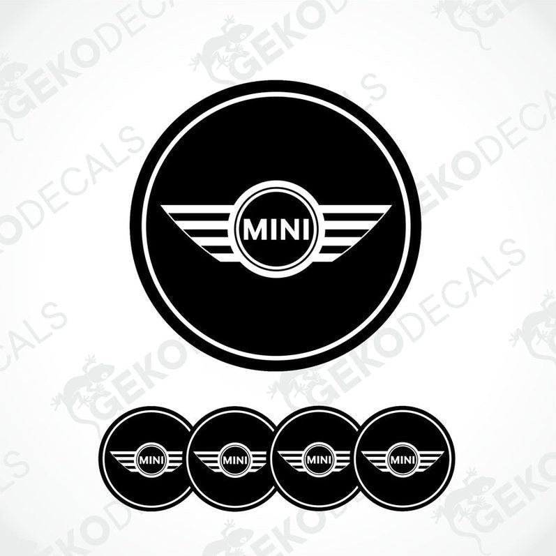 A set of black vinyl decals with the Mini Cooper logo, designed for use as car wheel stickers.