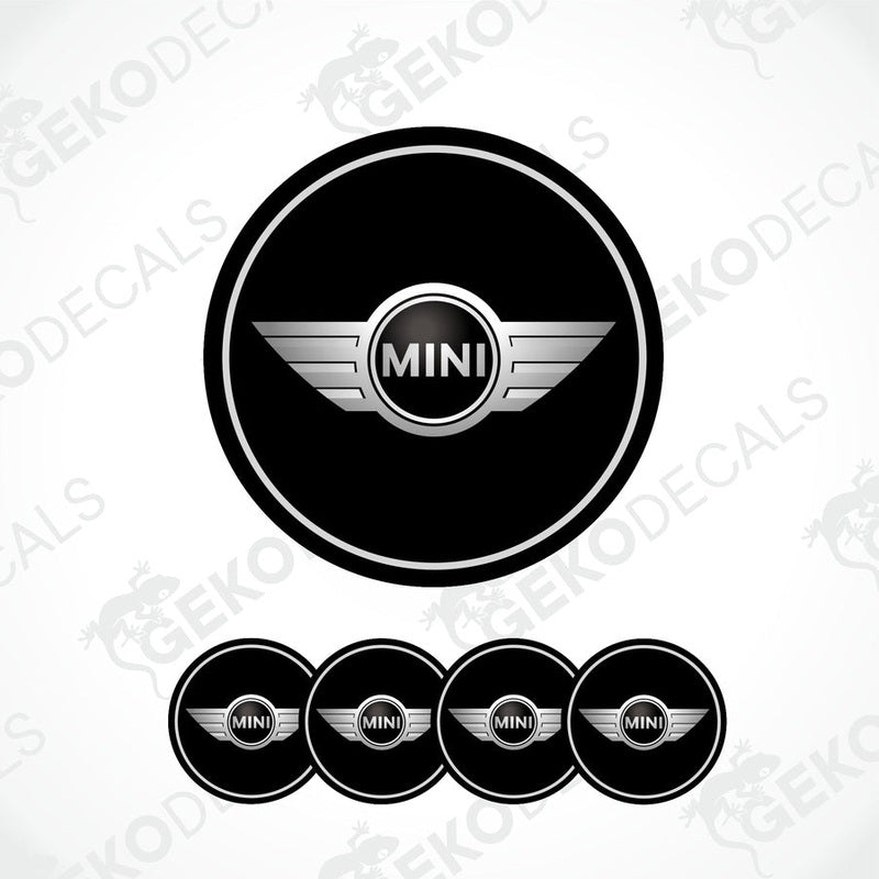 A set of four black vinyl stickers with the word 'MINI COOPR' in the center, designed to be applied on car wheels.