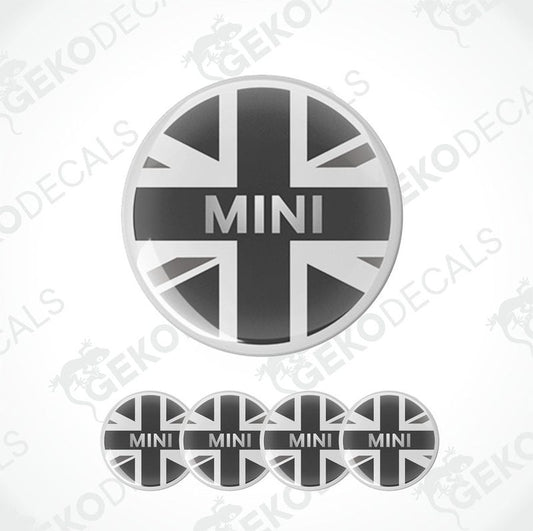 A set of four round vinyl stickers with a design of the British flag and the word 'MINI' in the center, displayed on a white background.