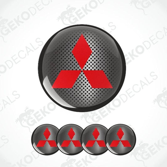 A set of four red and black vinyl stickers with a geometric pattern, representing the Mitsubishi brand.