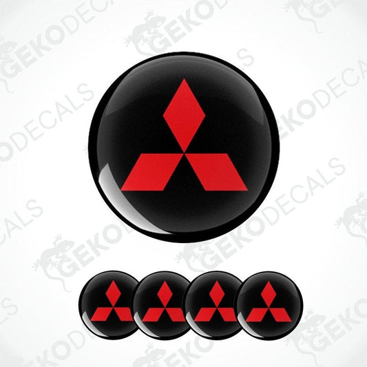 A set of four round car decals featuring the Mitsubishi logo in red on a black background.