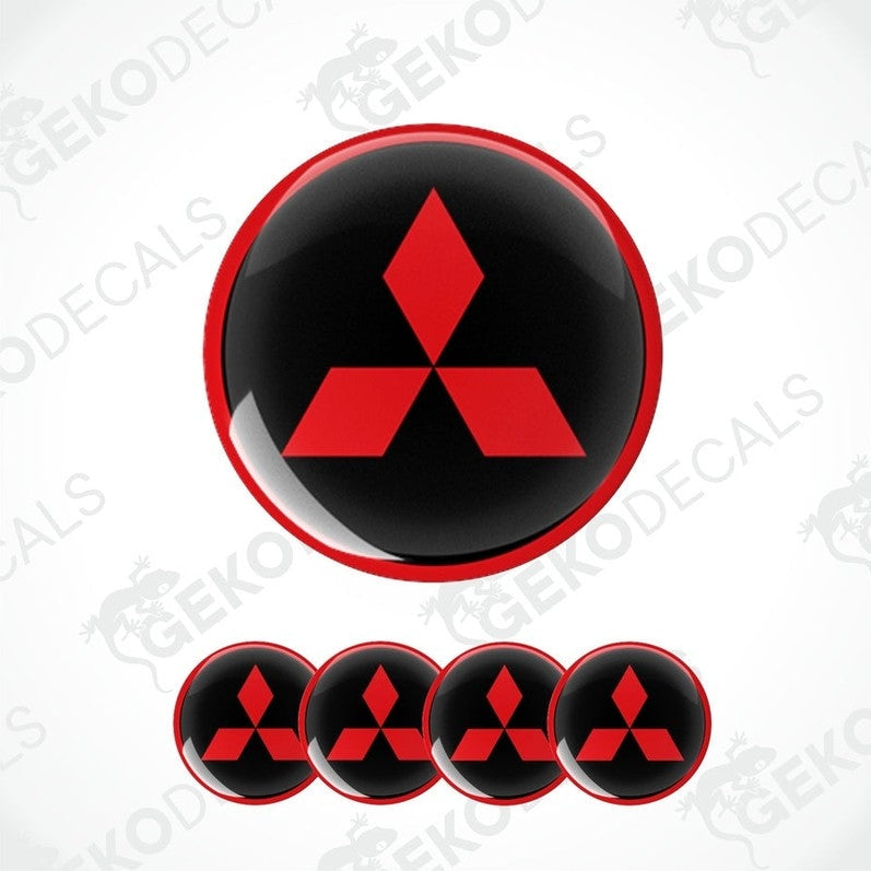 A set of four round car decals featuring the Mitsubishi logo in red on a black background.