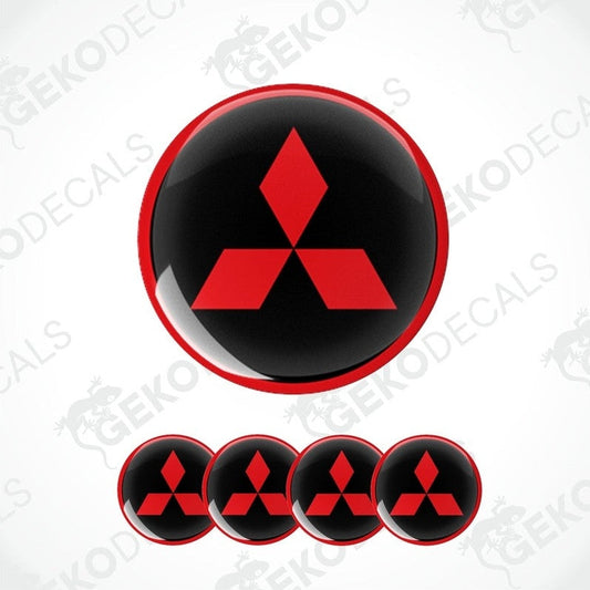 A set of four round car decals featuring the Mitsubishi logo in red on a black background.
