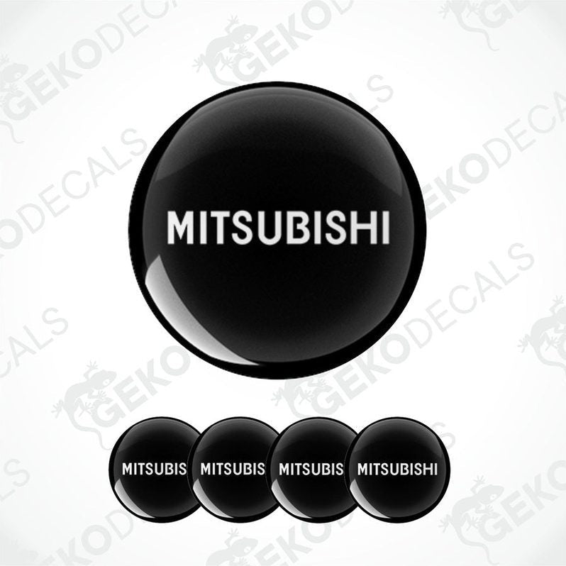 A set of black vinyl decals with the Mitsubishi logo, including one large decal and four smaller ones.