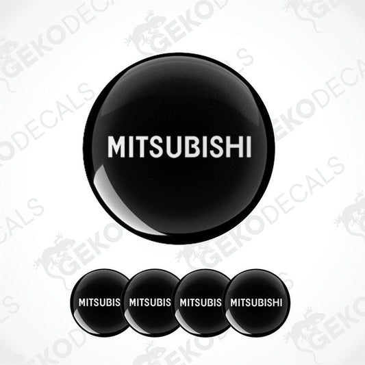 A set of black vinyl decals with the Mitsubishi logo, including one large decal and four smaller ones.
