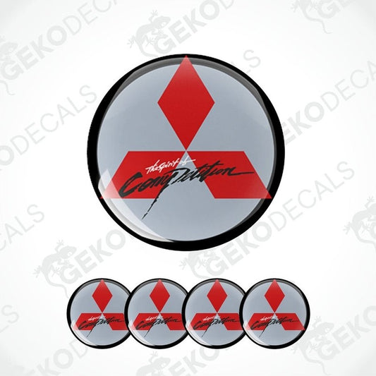 A set of four round vinyl stickers with a geometric design featuring red and gray colors and the Mitsubishi brand logo.
