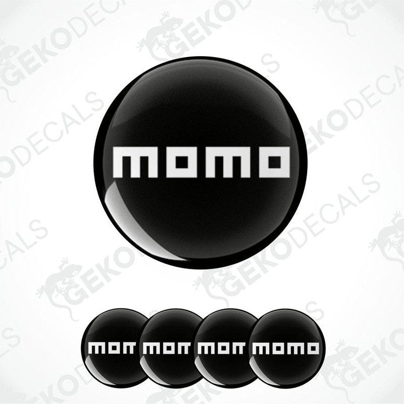 A set of black vinyl decals with the text 'momo' on them, presented in a circular arrangement.