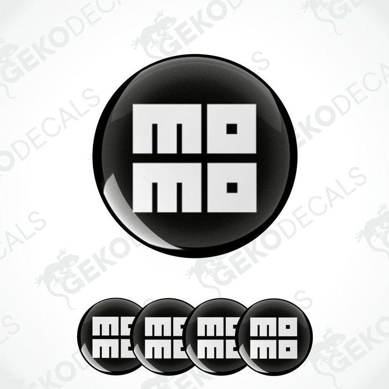 A set of four round vinyl stickers with the word 'MOMO' written on them, with a black background and a white border.