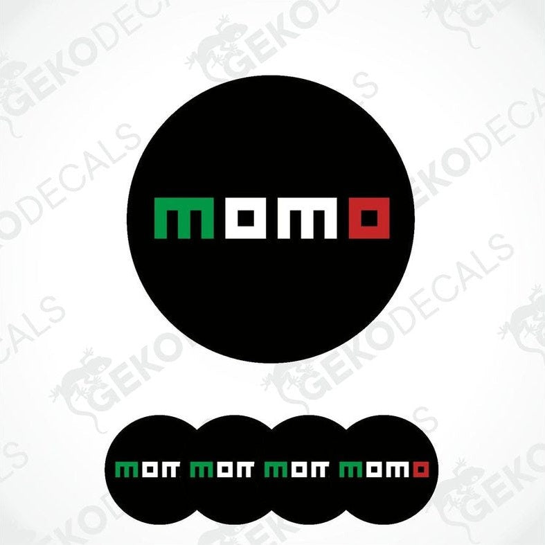 A set of four round black vinyl stickers with the word 'MOMO' written on them in red and green colors.