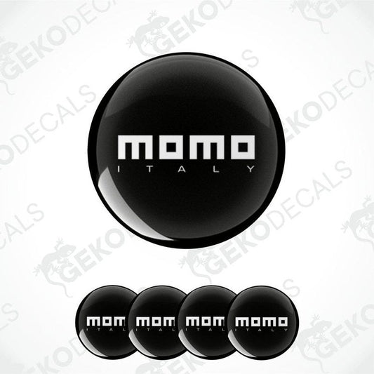 A set of black vinyl decals with the text 'momo ITALY' in white. The set includes four domed stickers of varying sizes.
