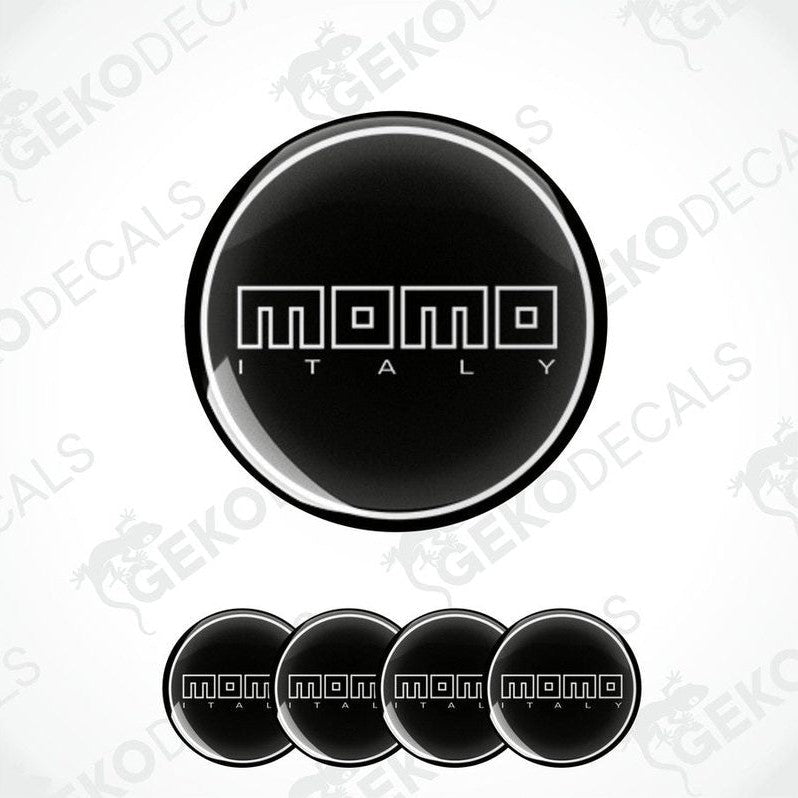 A set of black vinyl decals with the text 'momo ITALY' in white. The decals are designed to be applied on a surface, likely for car customization.