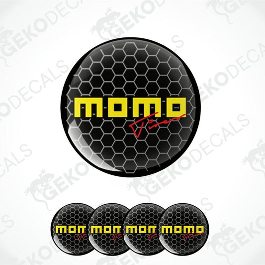 A set of four round black vinyl decals with the text 'momo' in yellow.