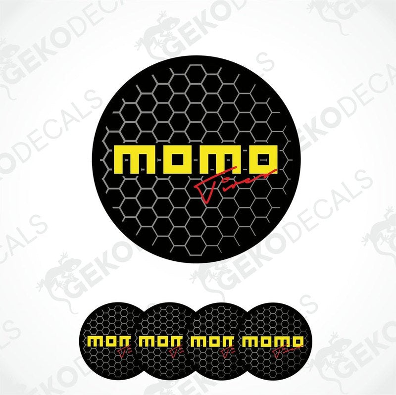 A set of four round black vinyl decals with the text 'momo' in yellow.