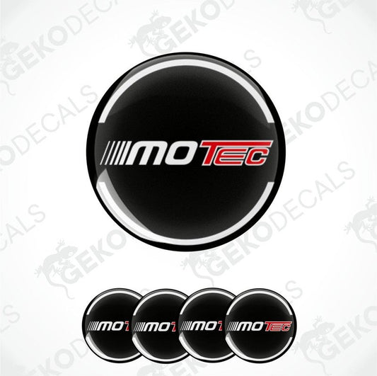 A set of four black vinyl stickers with the MOTEC brand logo in red and white.