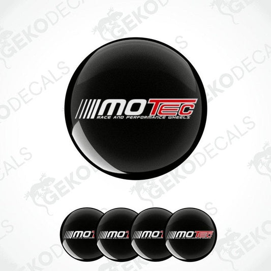A set of four black vinyl stickers with the 'MOTEC' logo in white and red, designed for use as car wheel decals.