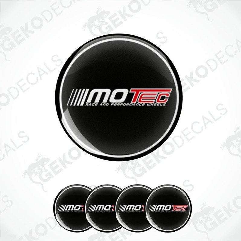 A set of four black vinyl stickers with the 'MOTEC' logo in white and red, designed for use as car wheel decals.
