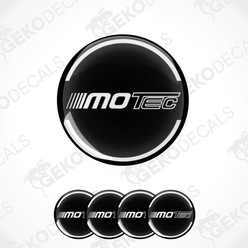 A set of four round vehicle decals with the text 'MOTEC' displayed in a central logo on a black background with white text.