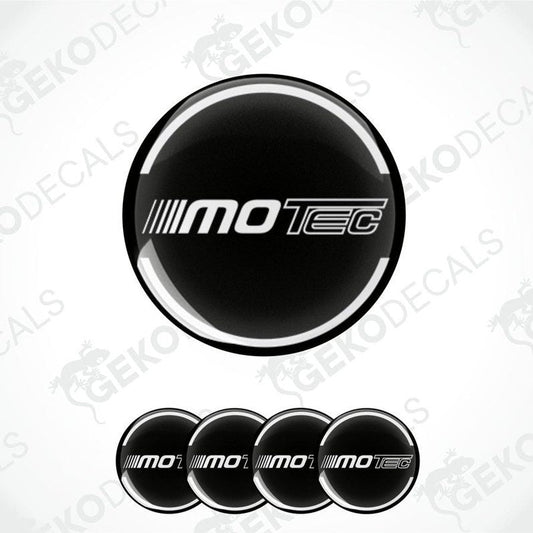 A set of four round vehicle decals with the text 'MOTEC' displayed in a central logo on a black background with white text.