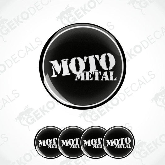 A set of four black and white vinyl decals with the text 'MOTO METAL' on a round, domed sticker design.