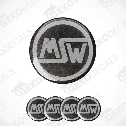 A set of four black vinyl stickers with the letters 'MSW' in the center, arranged in a circular pattern with a visible brand logo.