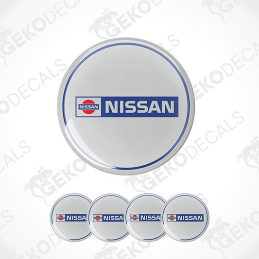 A set of four vinyl decals with polyurethane coating, featuring the Nissan logo, presented on a white background.