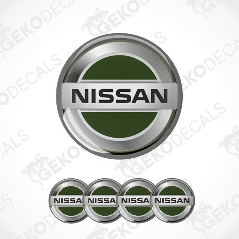 A set of four green and silver NISSAN branded vinyl decals with a silver and black trim.