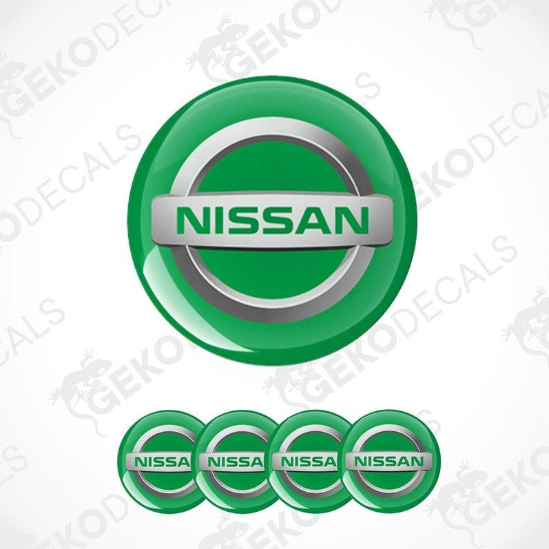 A set of four green vinyl stickers with the NISSAN brand logo on them.