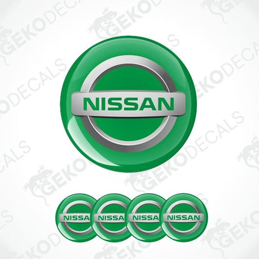 A set of four green vinyl stickers with the NISSAN brand logo on them.