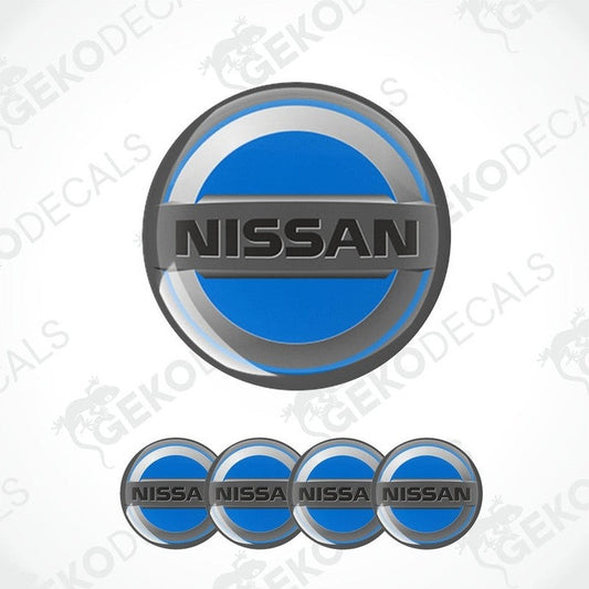 A set of four blue, silver, and black NISSAN branded vinyl stickers with a dome shape and a polyurethane coating.