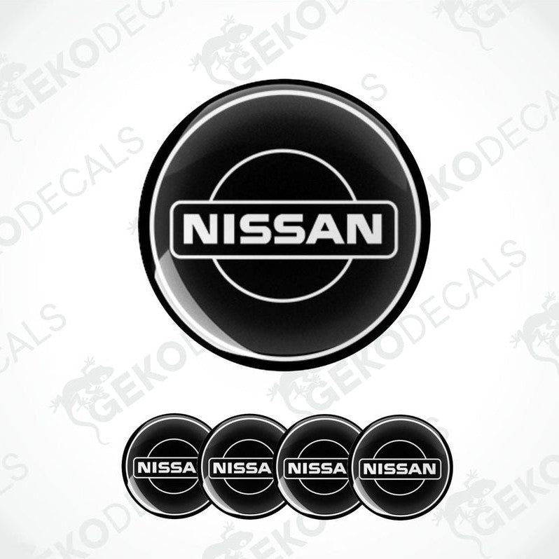 Set of five black vinyl decals with the NISSAN logo, four are round and one is rectangular.
