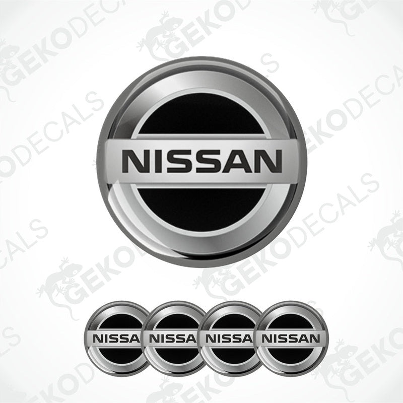 A set of four silver NISSAN branded vinyl stickers with a polyurethane coating.