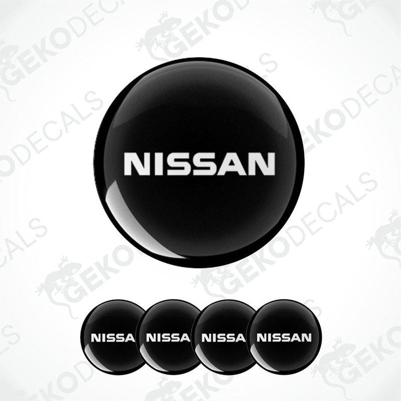 Set of five black vinyl decals with the NISSAN logo, four are round and one is rectangular.