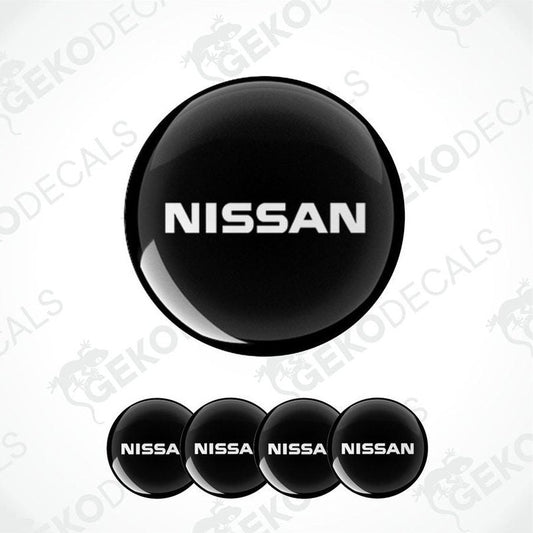 Set of five black vinyl decals with the NISSAN logo, four are round and one is rectangular.