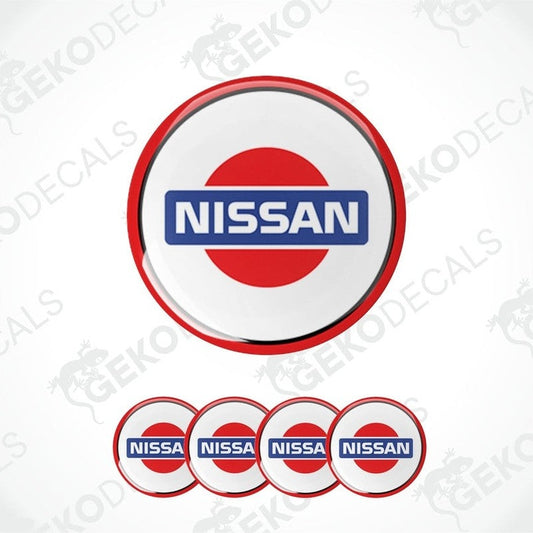 A set of four NISSAN branded vinyl stickers with a white background, red and blue design, and a polyurethane coating.