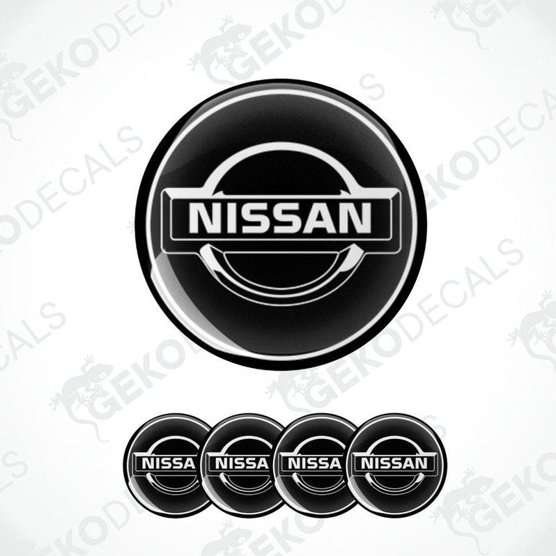 A set of four black vinyl decals with the NISSAN logo.