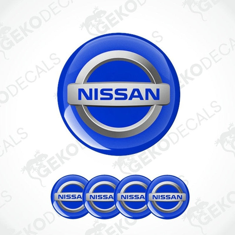 A set of four blue vinyl stickers with the NISSAN brand logo.