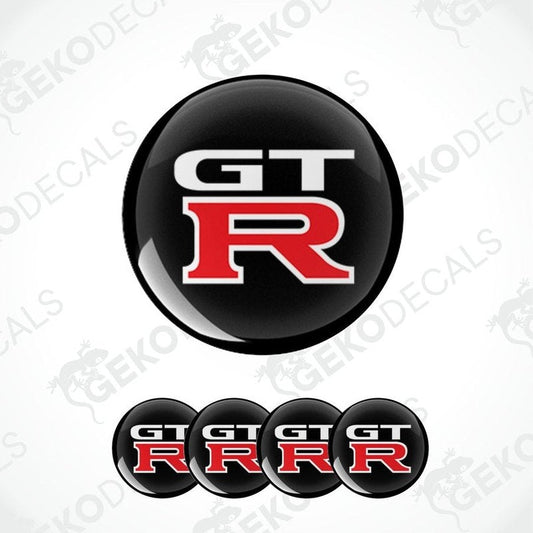 A set of four vinyl decals for a NISSAN GT R, featuring the GT R logo in black, red, and white colors.
