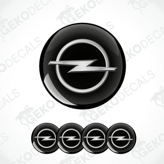 A set of black and silver OPEL brand vinyl decals with a polyurethane coating, including one larger decal and four smaller ones arranged in a row.