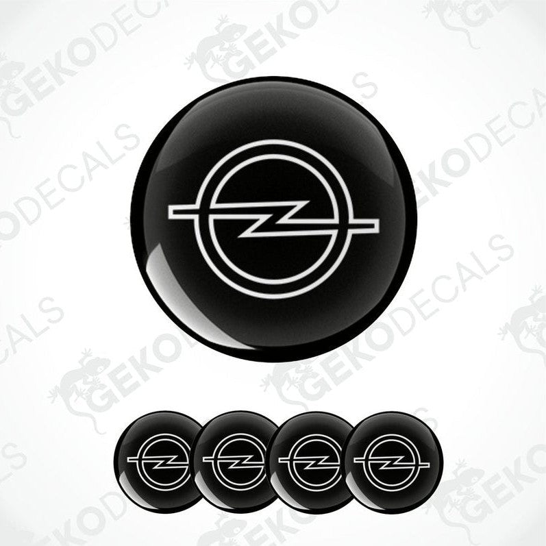 A set of four black and white vinyl decals with the Opel logo.