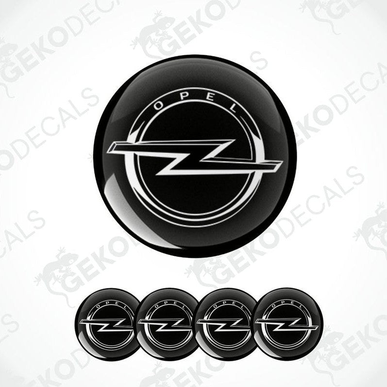 A set of four black vinyl stickers with the OPEL brand logo designed for use on car wheels.