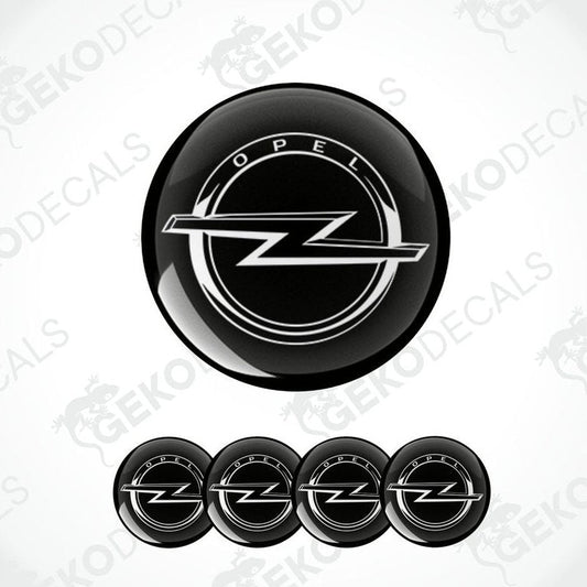 A set of four black vinyl stickers with the OPEL brand logo designed for use on car wheels.