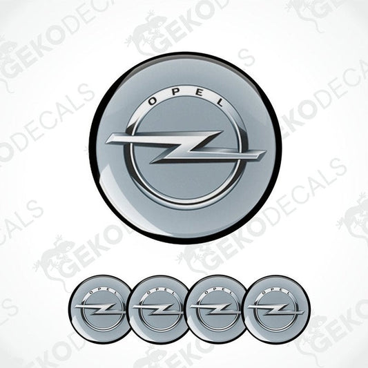 A set of four grey  vinyl stickers with a silver OPEL logo, designed for use as car decals.