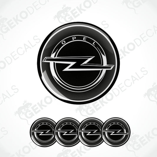 A set of four black vinyl stickers with the OPEL brand logo designed for use on car wheels.