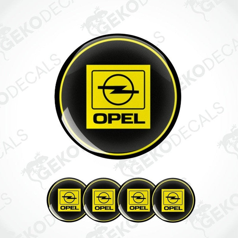 A set of four circular vinyl stickers with a yellow, black, and white color scheme, featuring the Opel brand logo.