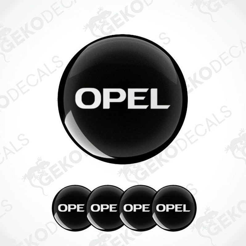 A set of four black vinyl stickers with the word 'OPEL' printed on them.