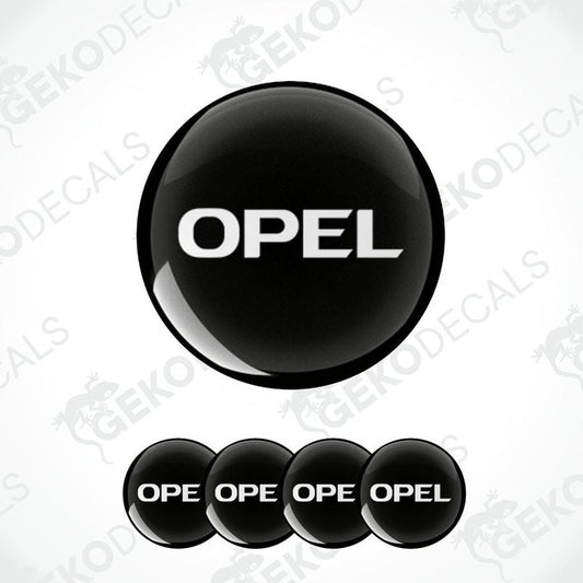 A set of four black vinyl stickers with the word 'OPEL' printed on them.