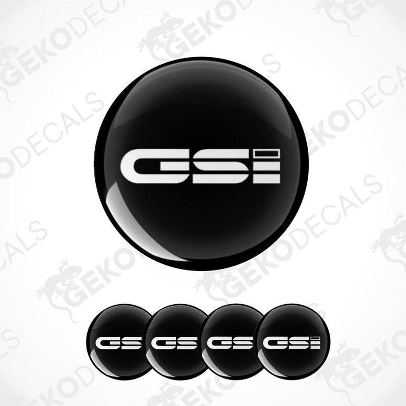 A set of black vinyl decals with 'OPEL GSi' text on them, typically used as car wheel caps.